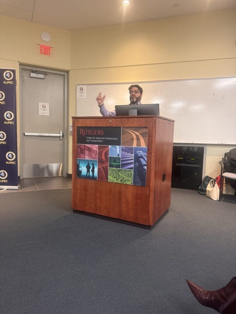 A speaker stands behind a podium